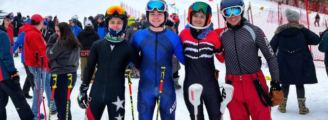 U16/U18 Skiers standing together smiling for a picture