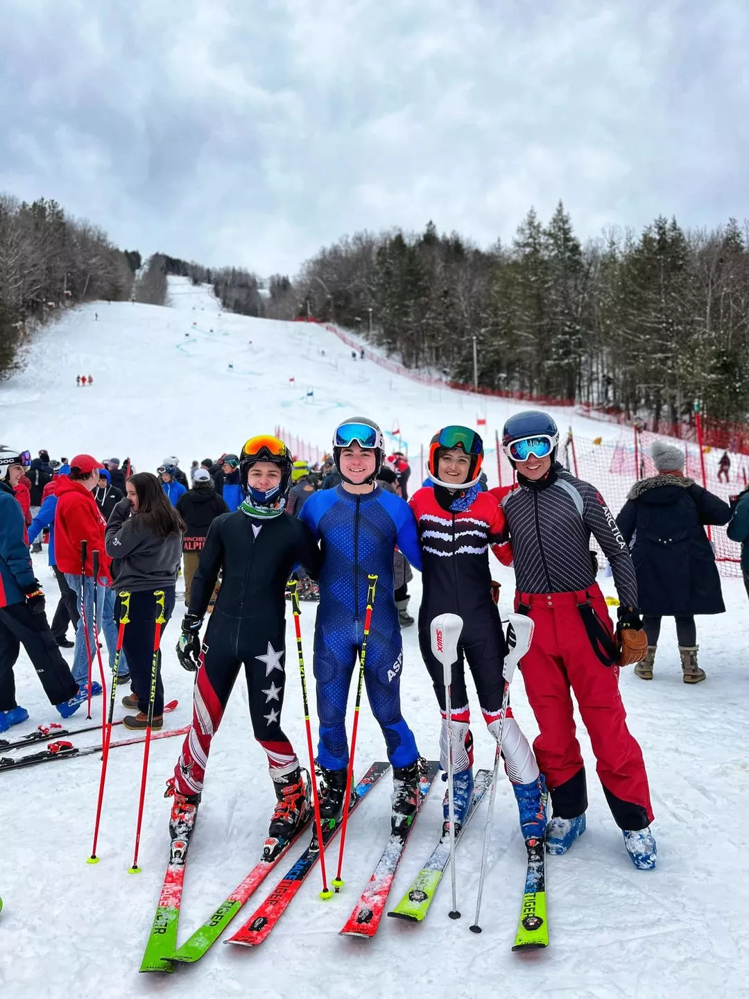 U16/U18 Skiers standing together smiling for a picture